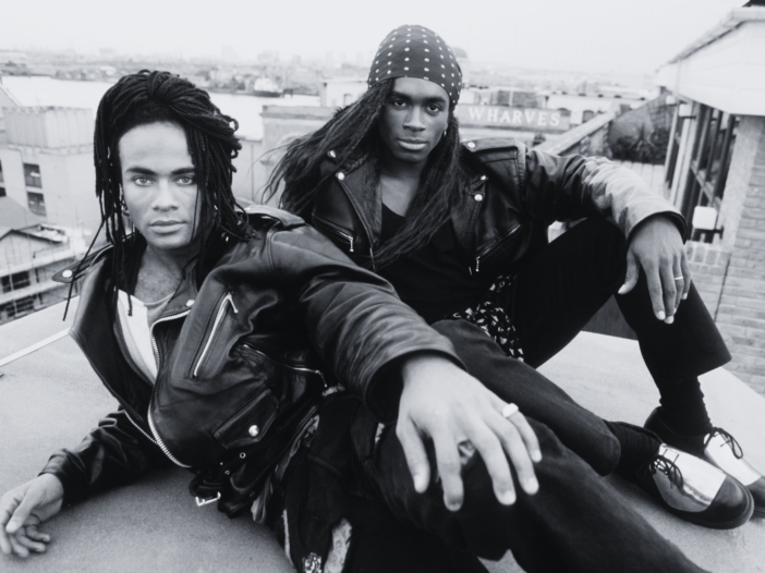 Milli Vanilli performing in the late 1980s, representing scripted and insincere performances used as a metaphor for scripted real estMilli Vanilli lip-sync scandal metaphor representing scripted and insincere relationship marketing in the real estate industryate marketing